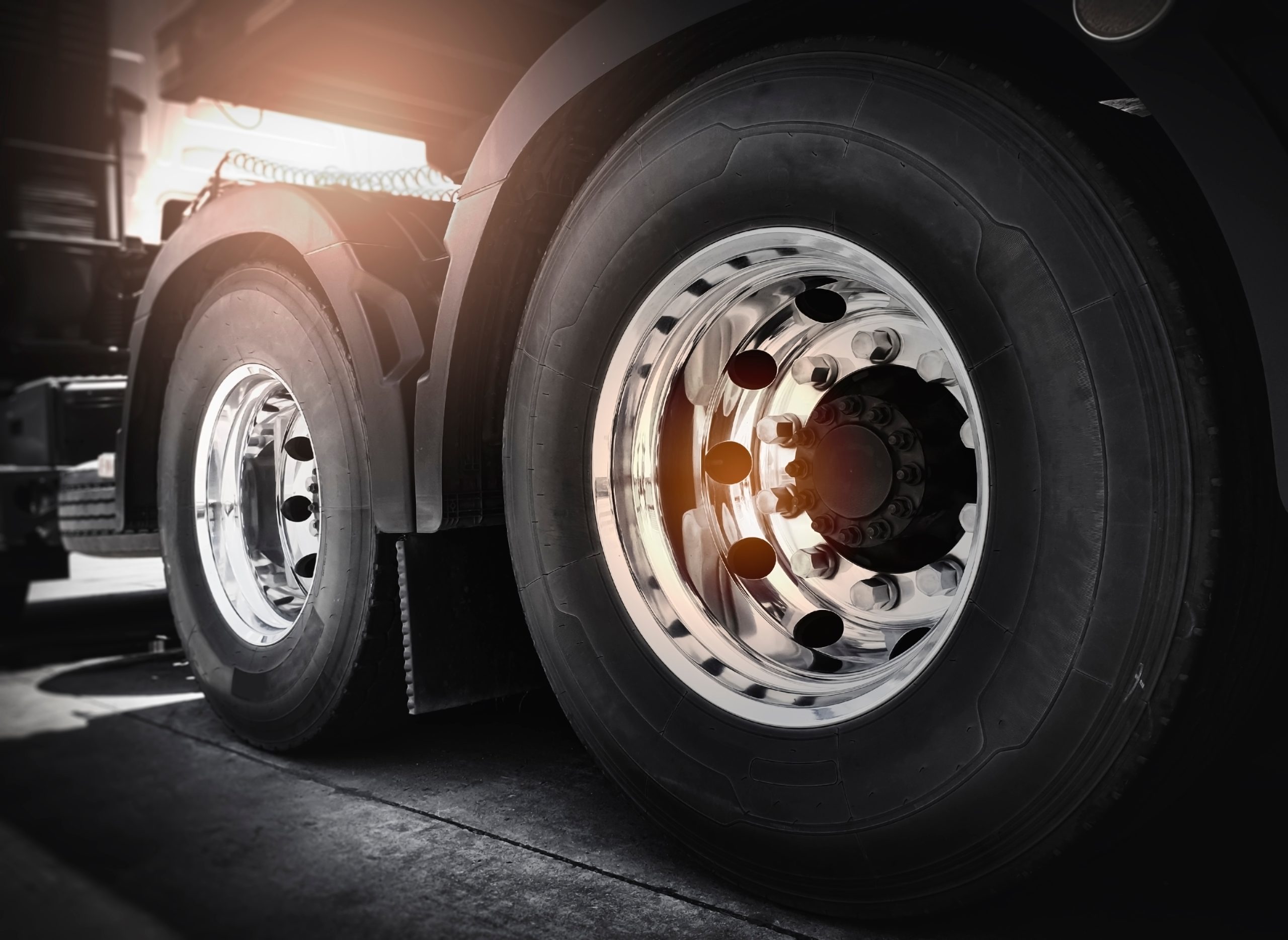 Semi truck, Freight transportation. Close-up large a truck wheels and tires.